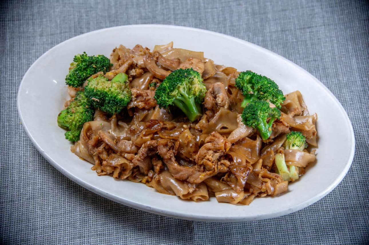 Pad See Ew - stir-fried wide rice noodles with broccoli